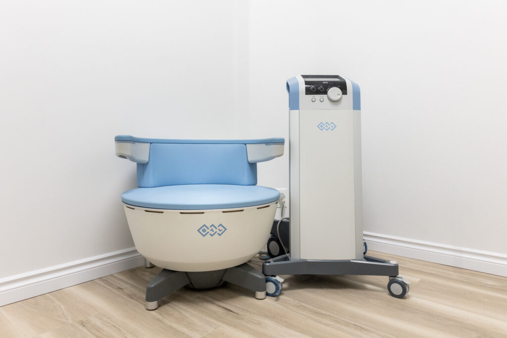The Emsella chair and workstation sit inside a medical spa. The device provides stress incontinence therapy in Rocky Mount.